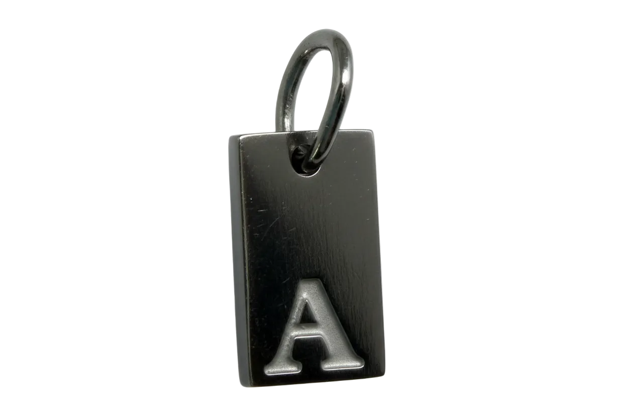 Black rectangular plate with raised silver letter A, polished silver finish