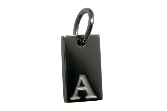 Black rectangular plate with raised silver letter A, polished silver finish