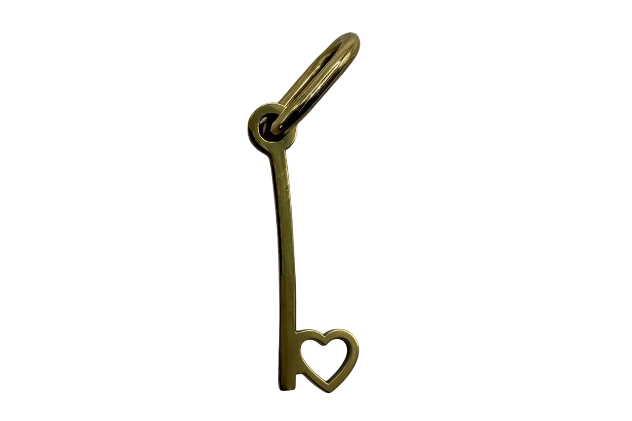 Gold safety pin charm with open heart detail