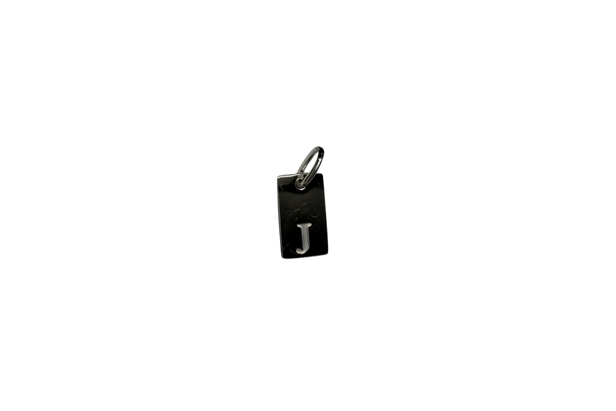 Black rectangular tag with raised silver letter J