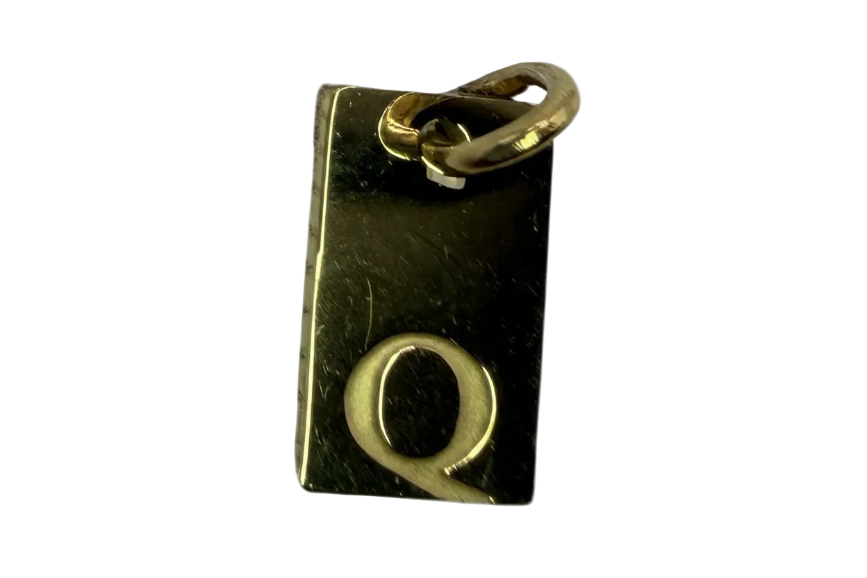 Black rectangular initial Q tag in gold finish with a small clear crystal accent