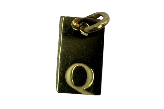 Black rectangular initial Q tag in gold finish with a small clear crystal accent