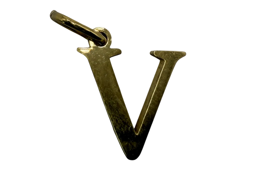 Polished gold letter V initial charm on black background
