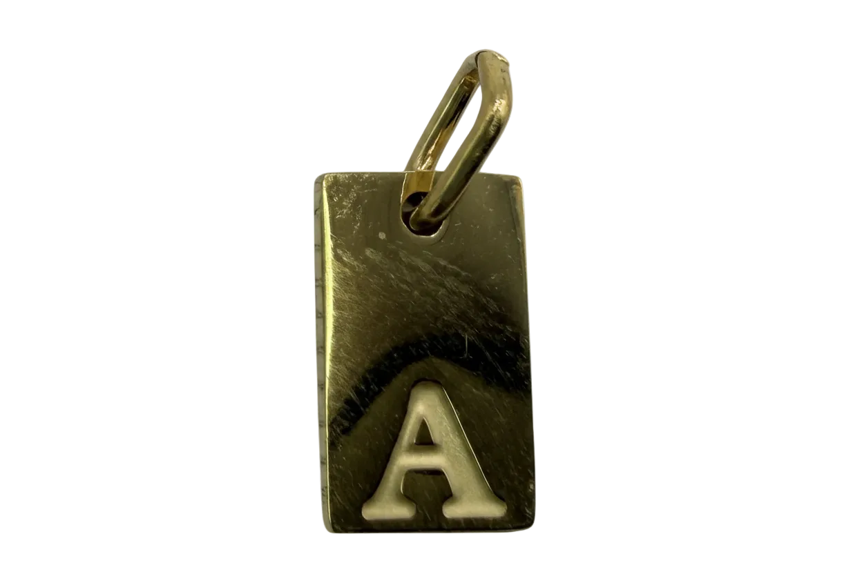 Gold rectangle tag with raised silver-tone letter A and brushed finish