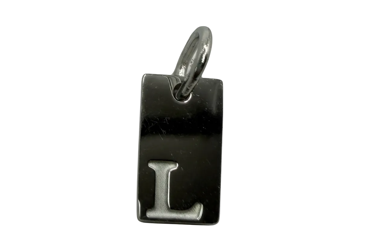 Polished silver rectangular tag with raised letter L