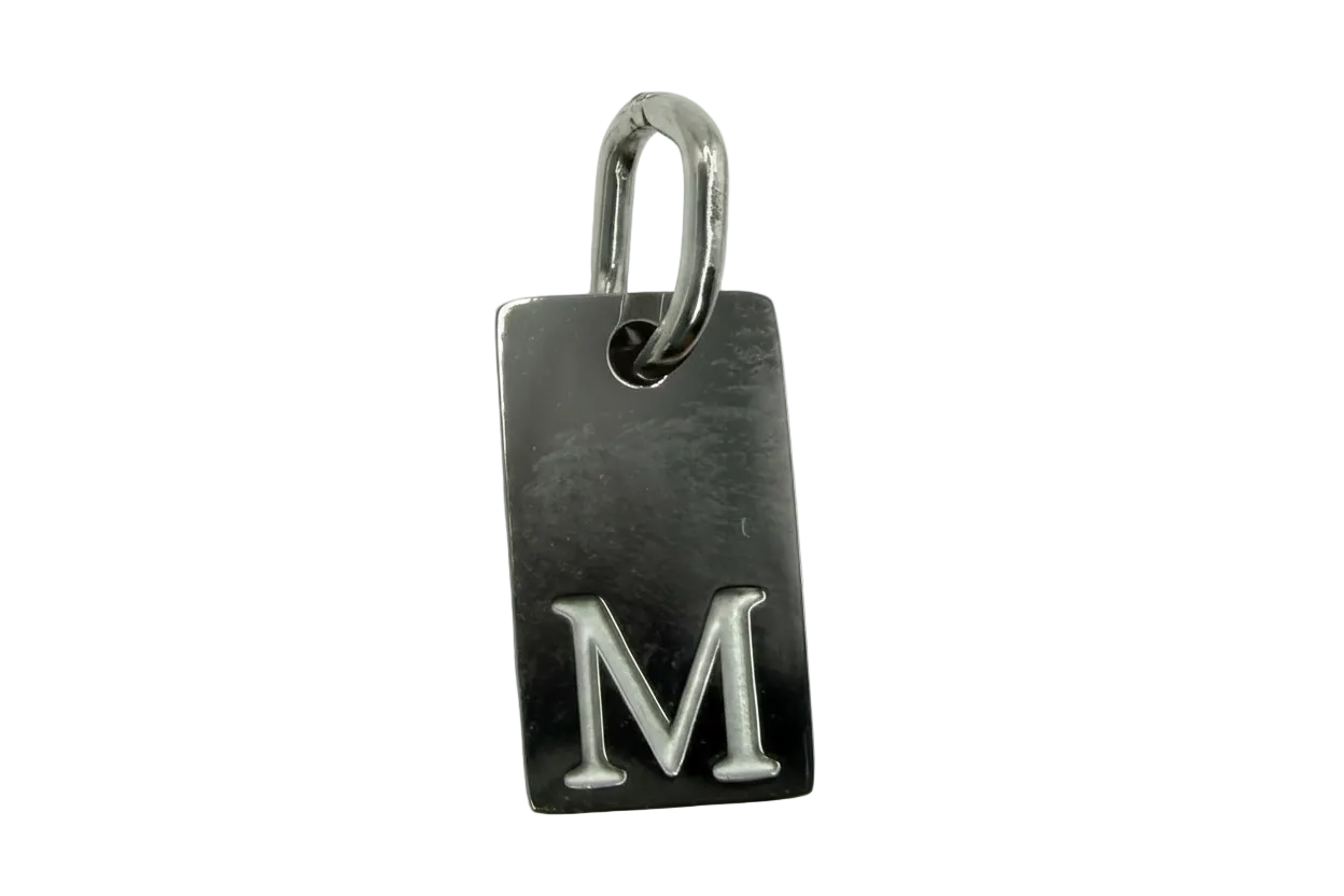 Polished silver rectangular tag with raised letter M