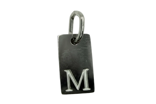 Polished silver rectangular tag with raised letter M
