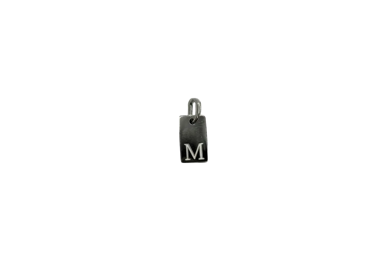 Silver rectangular tag with raised M
