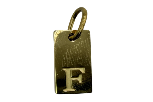 Polished gold rectangular initial tag with raised letter F