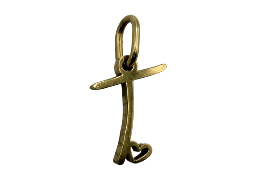 Gold script letter T with an open heart detail on a black background