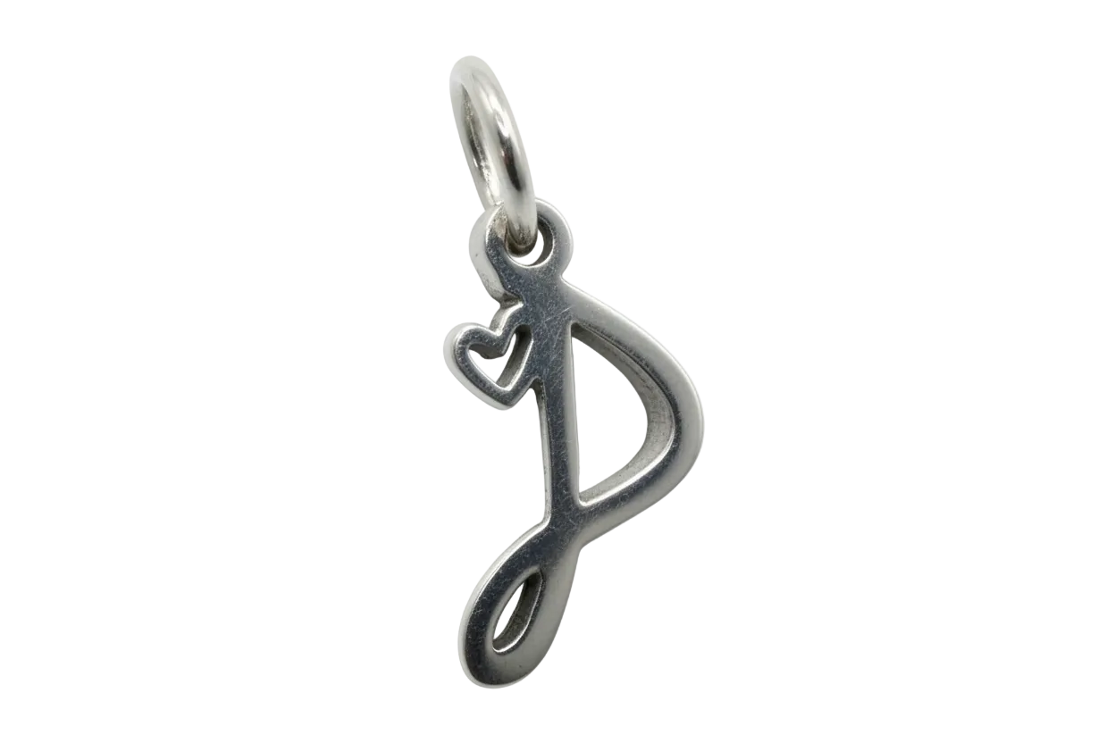 Polished silver treble clef note with a small heart cutout