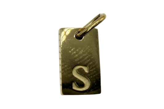 Polished gold rectangular tag with raised letter S