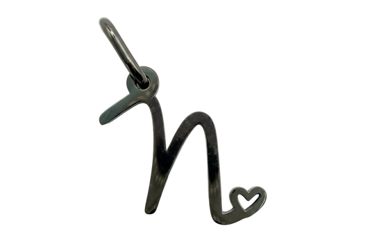 Polished silver script letter N with small open heart accent