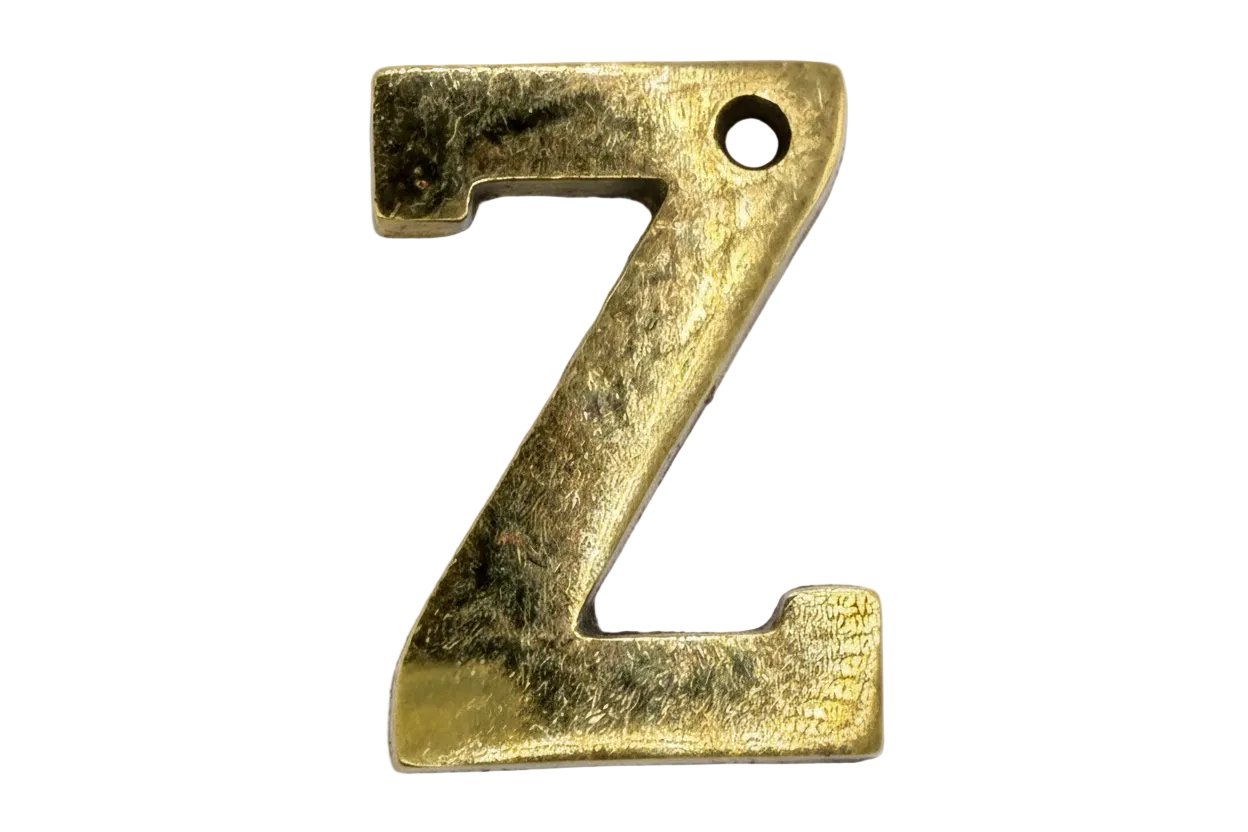 Textured gold letter Z with softly antiqued matte finish