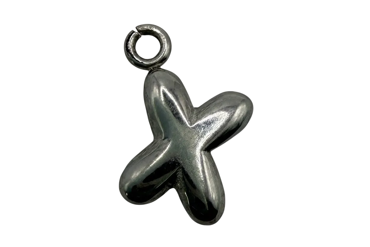 Polished silver starfish jewelry piece with smooth, rounded arms on black background