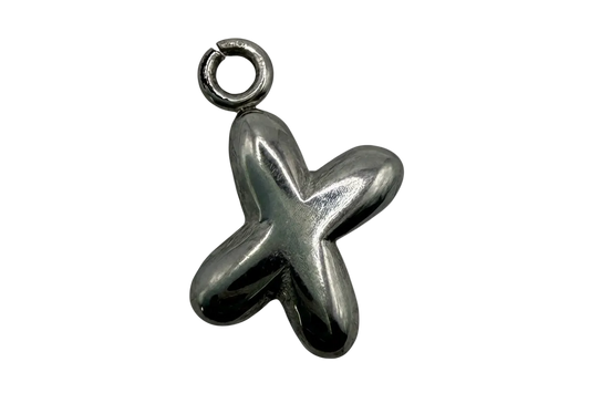 Polished silver starfish jewelry piece with smooth, rounded arms on black background