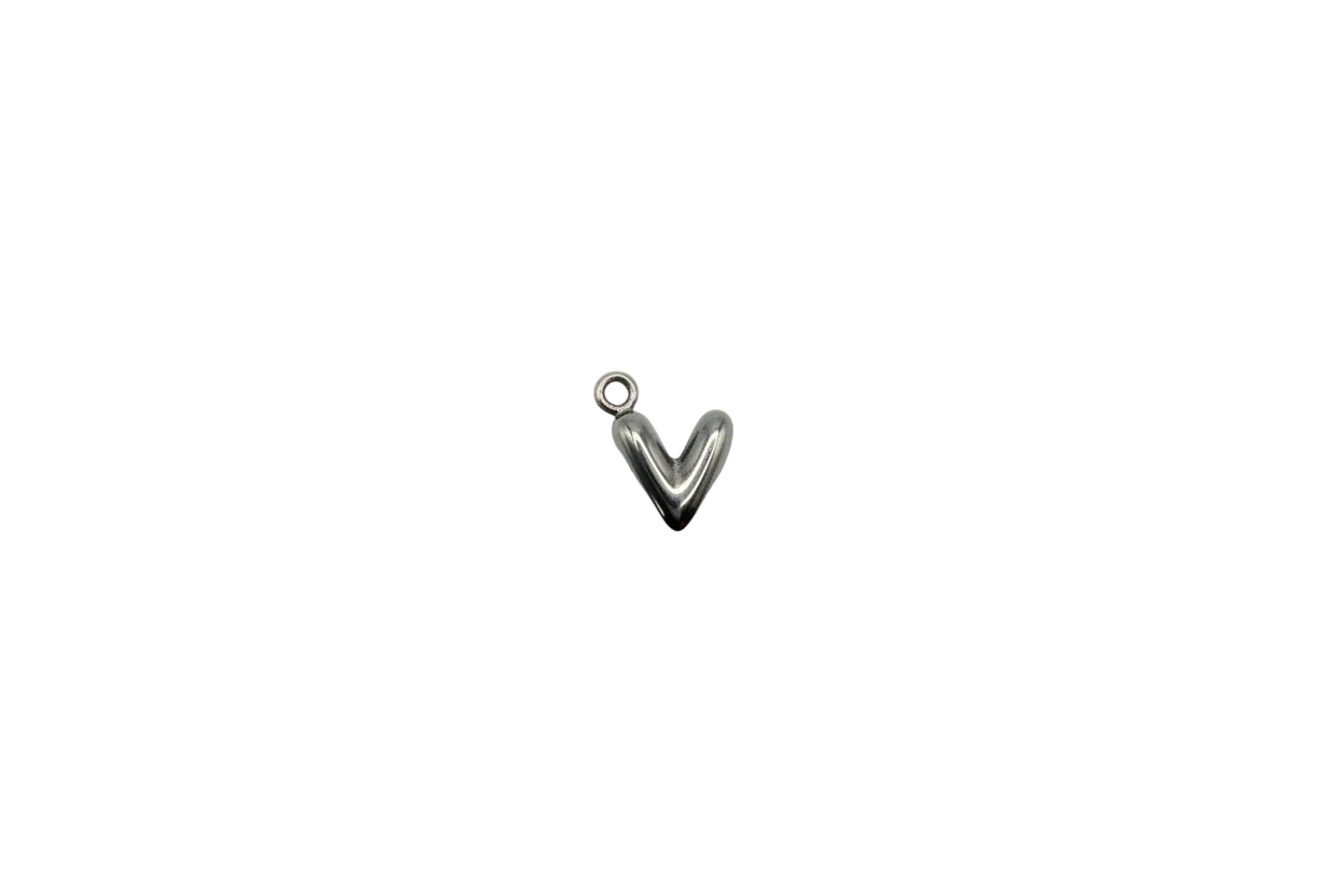Polished silver puffed heart with gold-toned accent