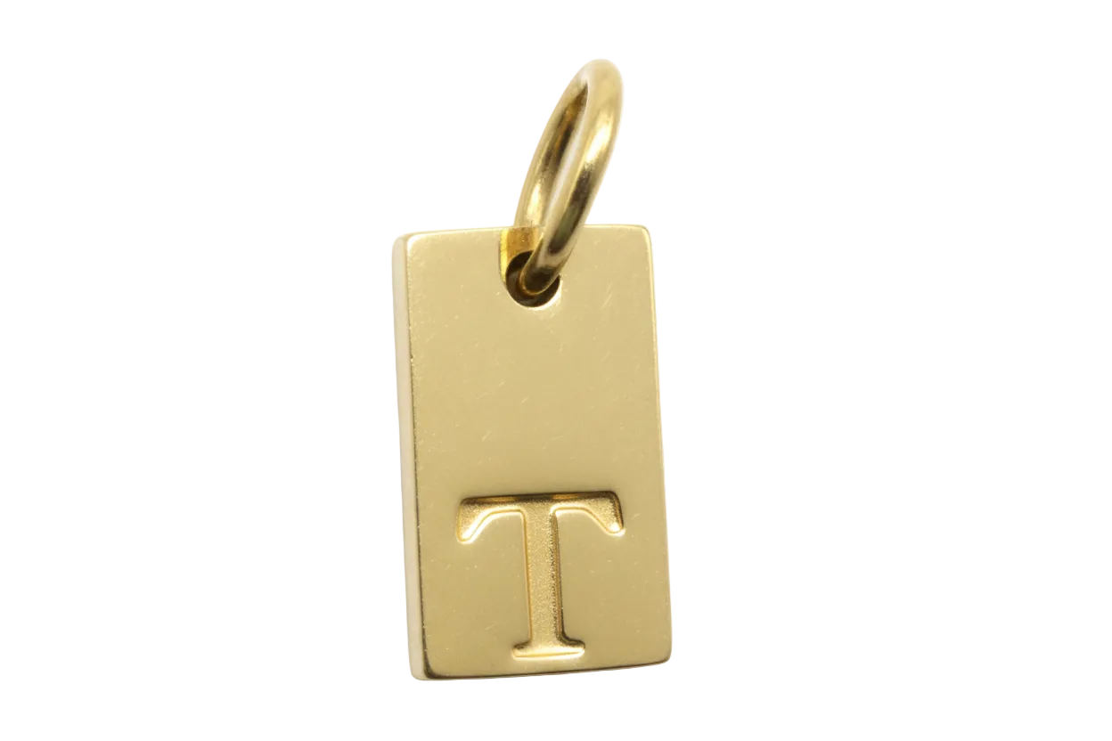 Polished gold rectangular tag with raised letter T