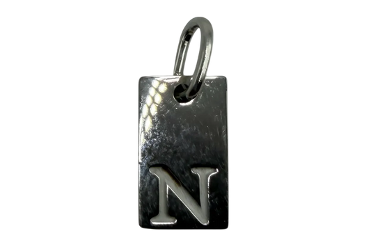 Polished silver rectangular tag with raised letter N initial