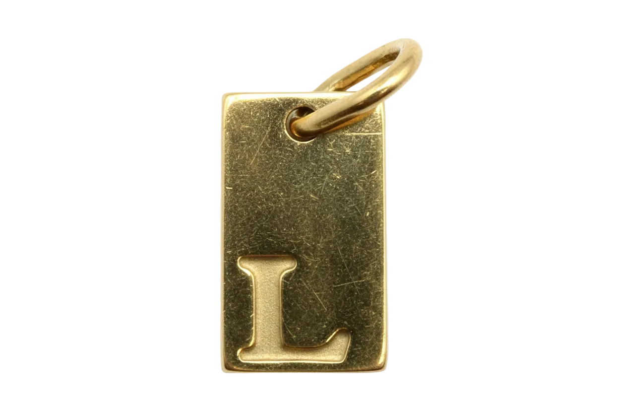 Polished gold rectangular tag with raised letter L initial
