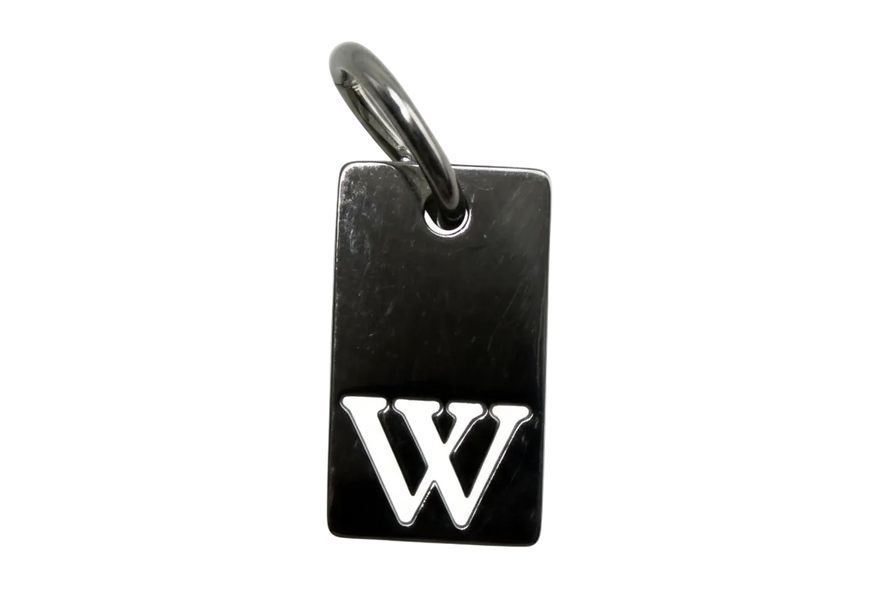 Glossy black rectangular tag charm with raised silver interlocking initials