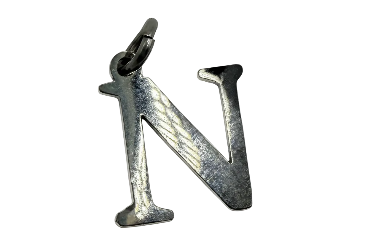 Polished silver letter N initial charm with reflective finish