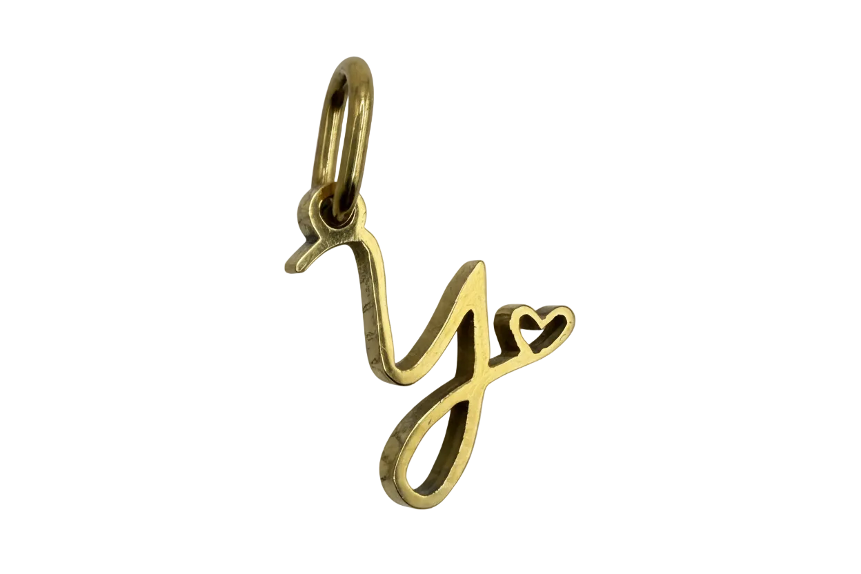 Polished gold script letter J initial with small heart detail