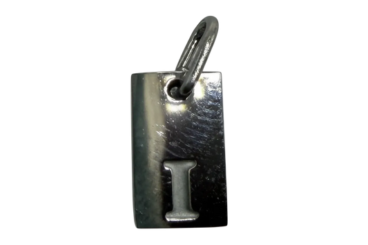 Polished silver-tone rectangular tag with raised letter I