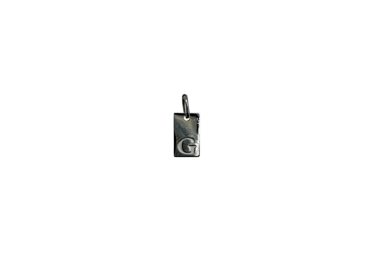 Silver rectangular tag with raised letter G