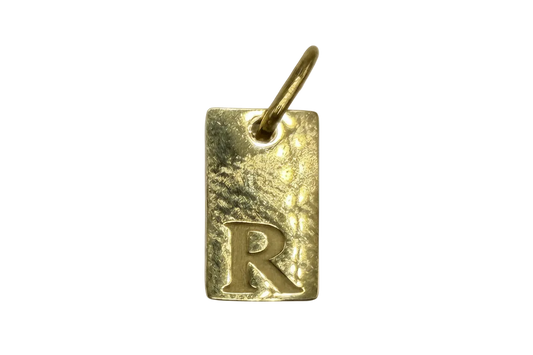 Gold rectangle tag with hammered texture and raised letter R