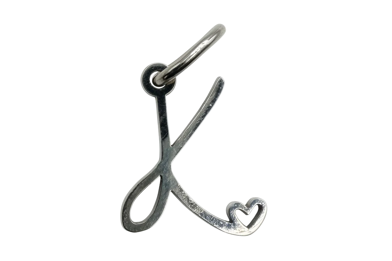 Polished silver script letter K with heart cutout accent
