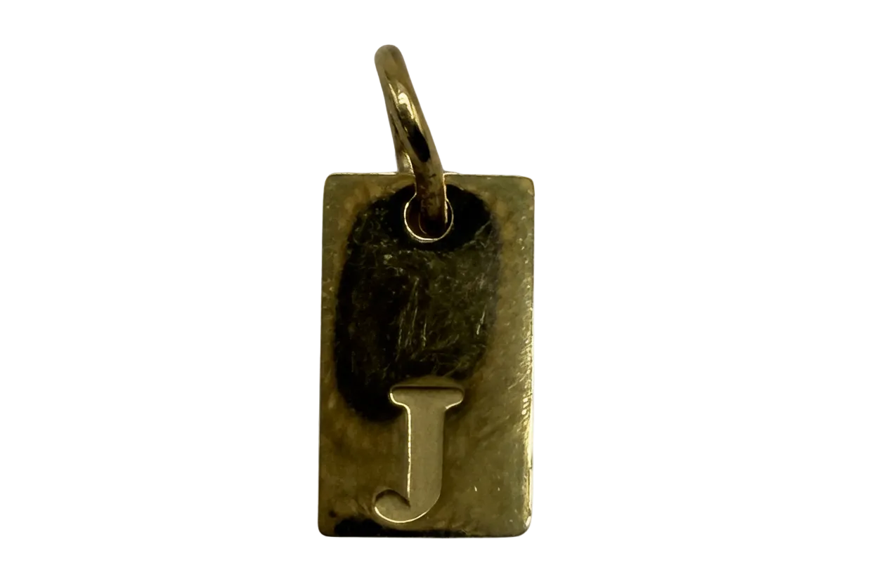 Gold rectangle initial tag with letter J and black accent