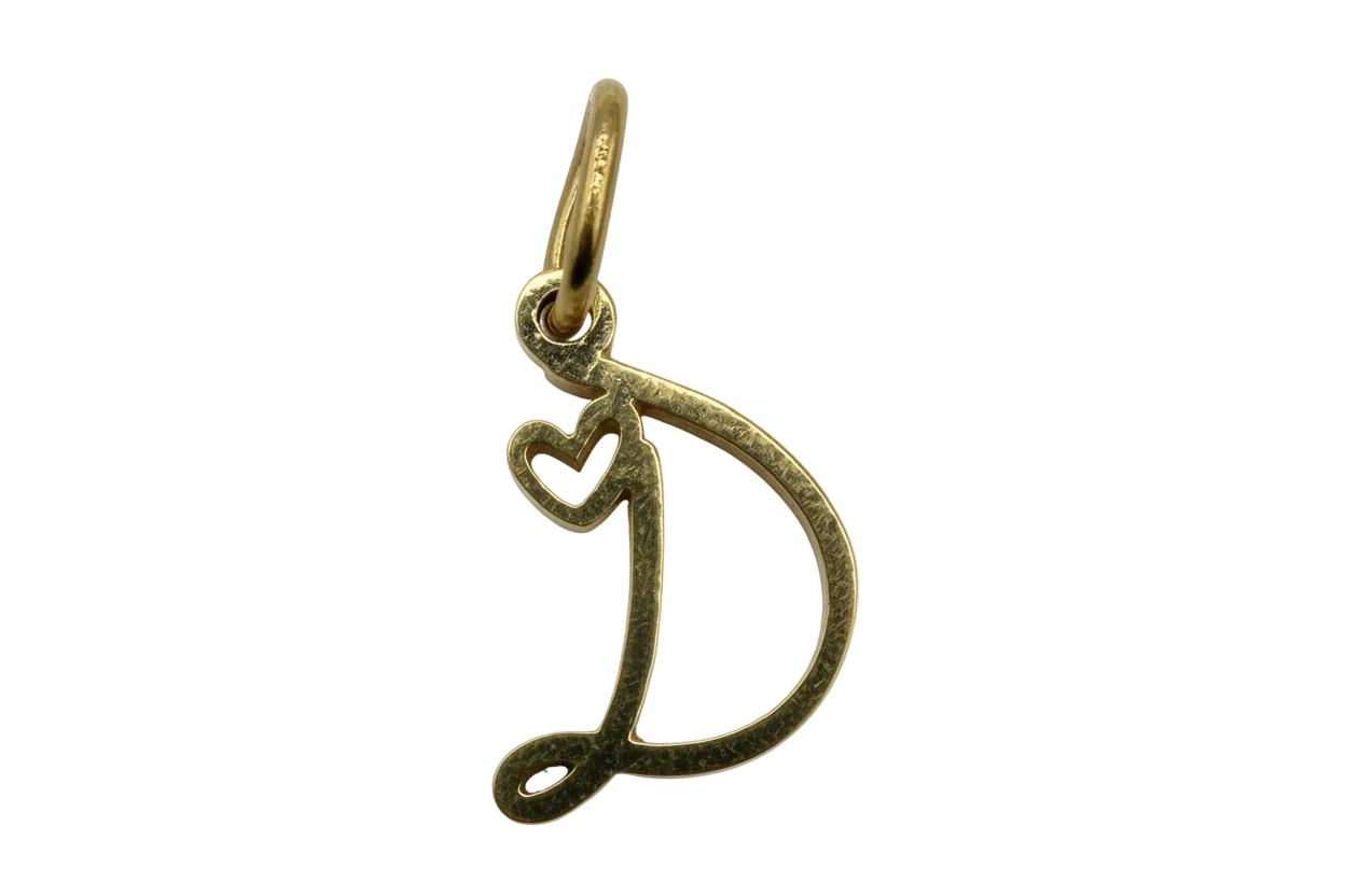 Gold letter D with small heart cutout detail and textured finish