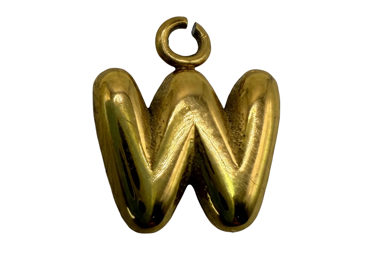 Polished gold puffy letter W initial with rounded sculptural shape