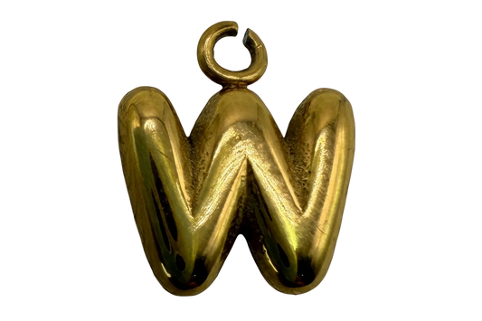 Polished gold puffy letter W initial with rounded sculptural shape