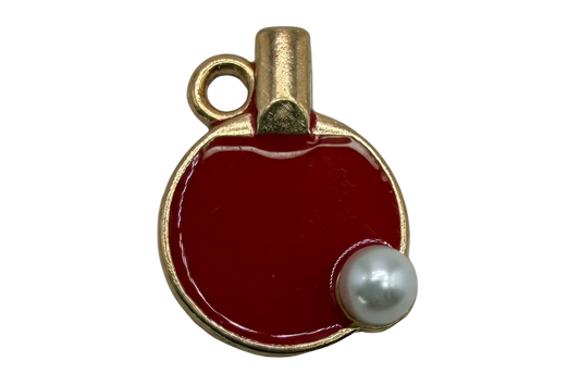 Glossy red enamel round flask charm with gold trim and black-and-white stopper detail