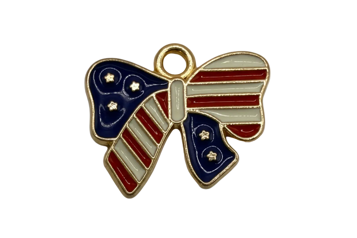 Gold-outlined bow with red and white stripes, navy enamel panels, and small star details