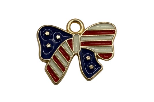 Gold-outlined bow with red and white stripes, navy enamel panels, and small star details