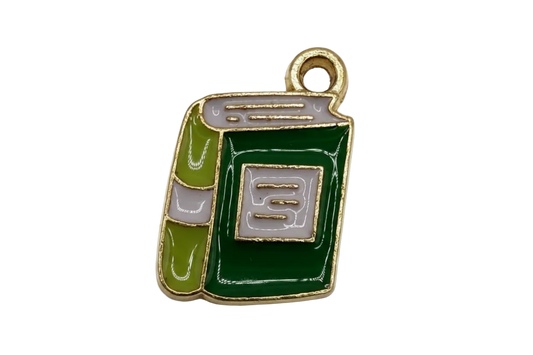 Glossy green hardcover book charm with olive spine, gray label, and gold outline