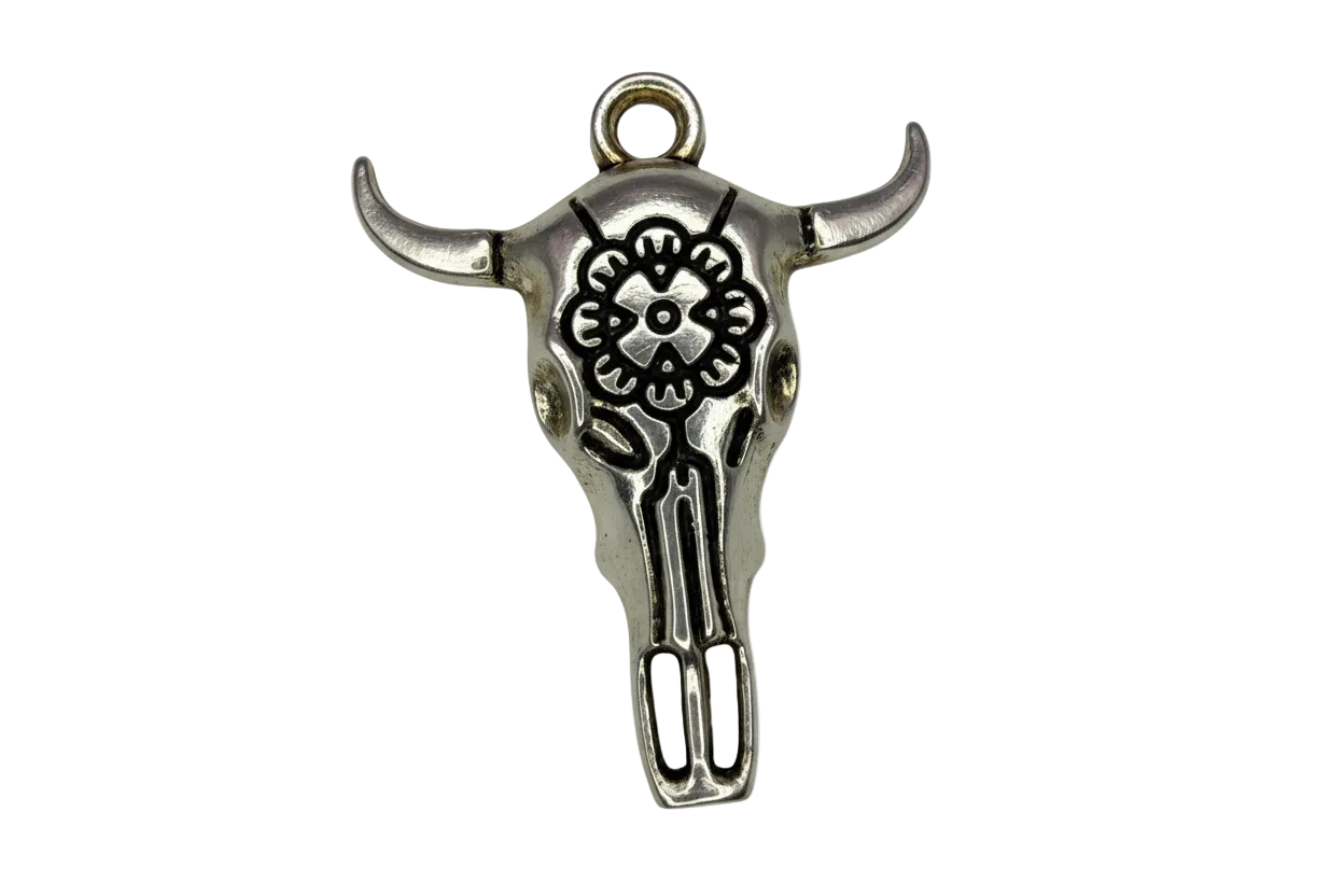 Antiqued silver bull skull charm with engraved flower motif and blackened detailing