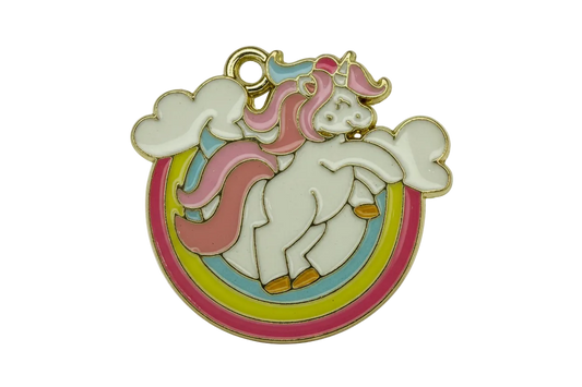 Gold-outlined pastel enamel unicorn over rainbow with clouds on a black background
