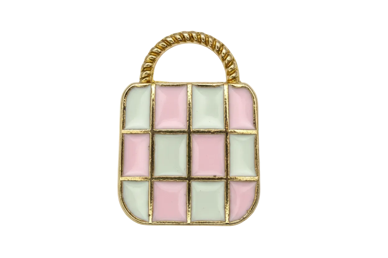 Gold-outlined handbag motif with pastel pink and mint checkered enamel and a light gray handle pattern