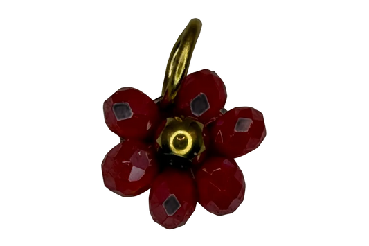 Faceted red flower cluster charm with polished gold center