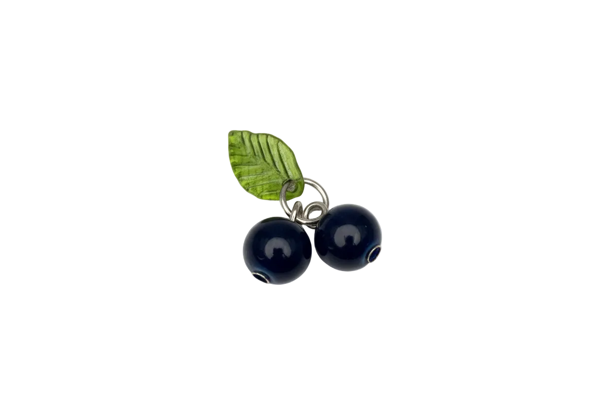 Silver piece with two navy evil-eye beads and green leaf