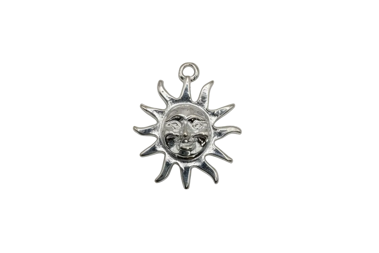 Silver sunburst medallion with sculpted face