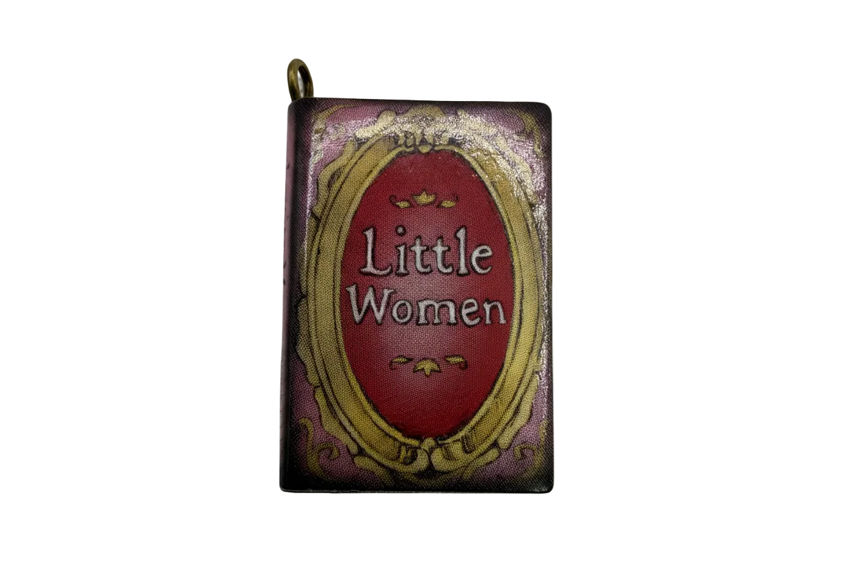 Vintage mini book charm with burgundy label and ornate gold frame on a purple cover, glossy finish