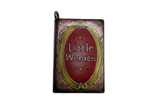 Vintage mini book charm with burgundy label and ornate gold frame on a purple cover, glossy finish