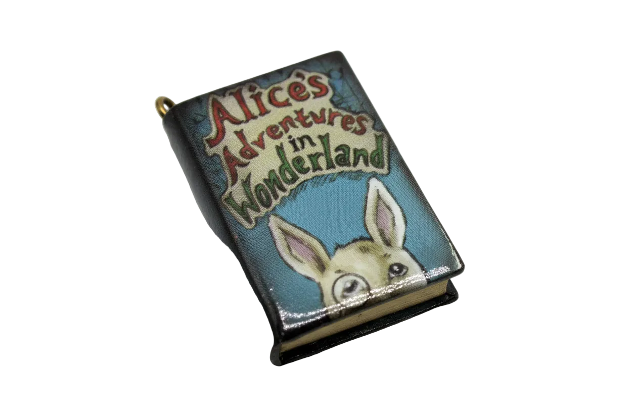 Vintage-style rabbit storybook cover charm with multicolor lettering on a blue background, gold finish