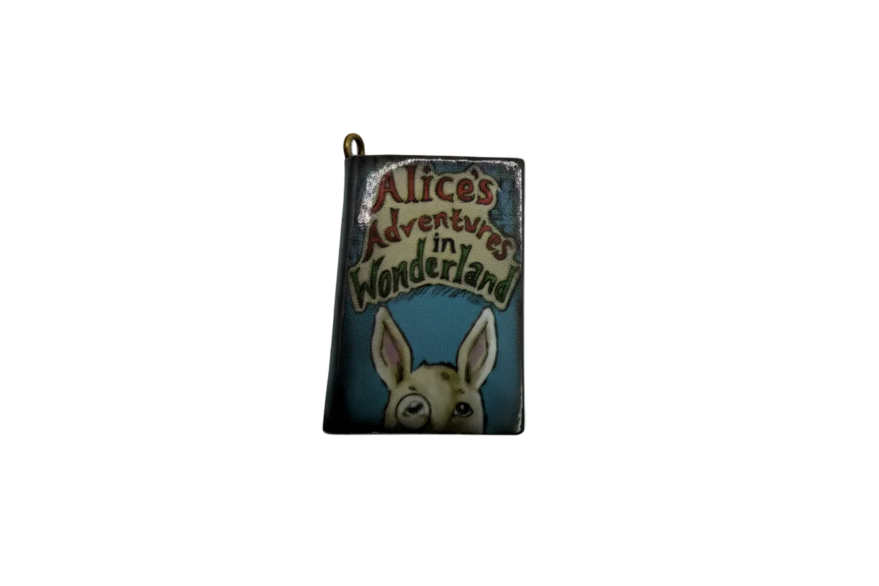 Rabbit storybook cover charm with multicolor lettering, blue background, gold