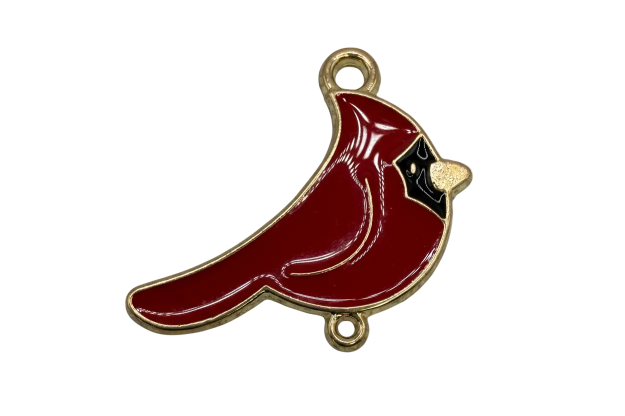 Glossy crimson cardinal bird with black face detail and gold trim
